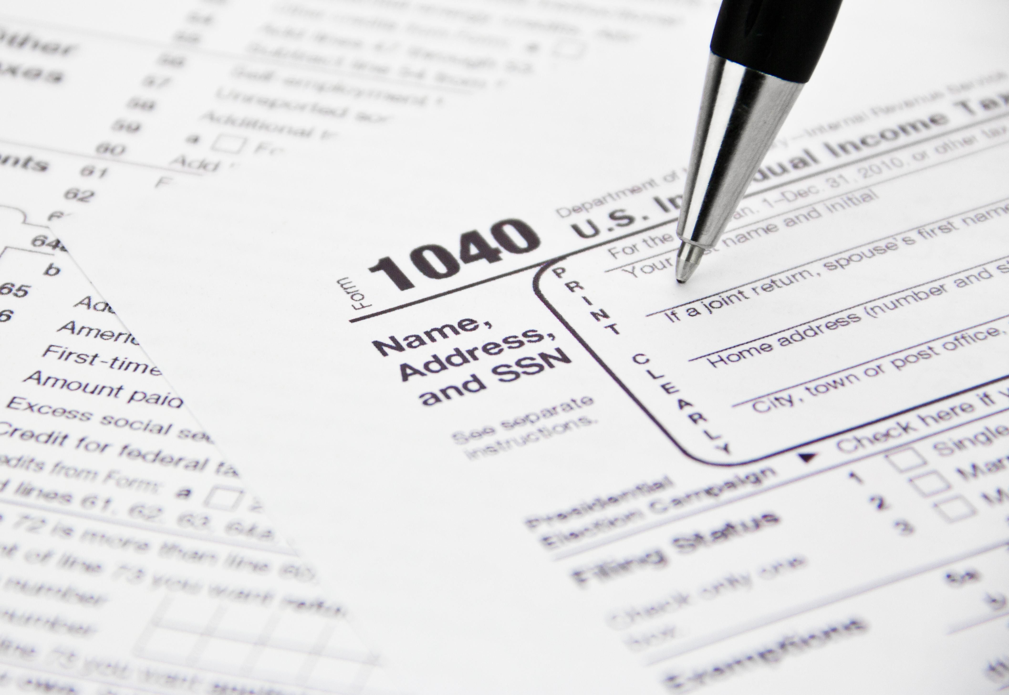 IRS tax form 1040 being filled out.